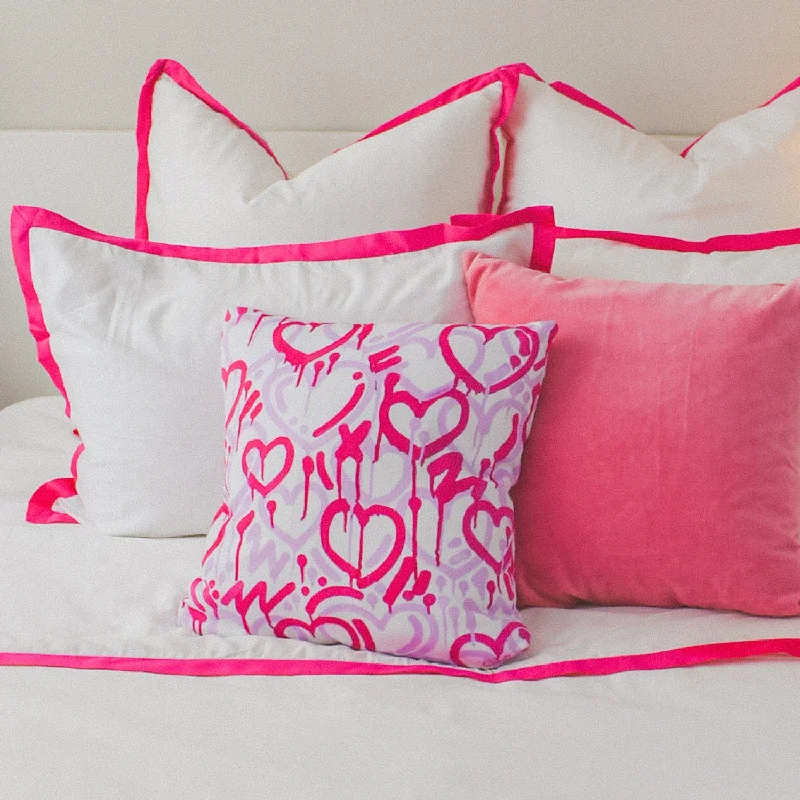 Plush Pillows for a Cozy BedGraffiti Hearts Throw Pillow by Corey Paige